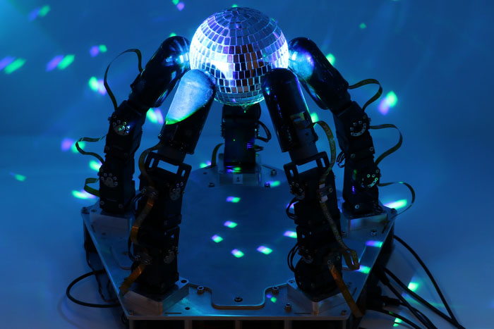 Using its sense of touch, the robot hand can manipulate in the dark, or in difficult lighting conditions