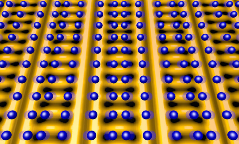 This image shows the positions of the atoms (blue spheres) that make up the copper-oxide superconducting crystal lattice, superimposed on an electronic charge distribution map (yellow is high charge density, black spots are low) in a charge-ordered state.