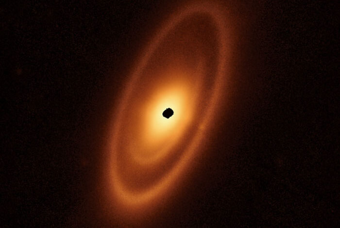 A disk of dusty debris surrounding the young star Fomalhaut