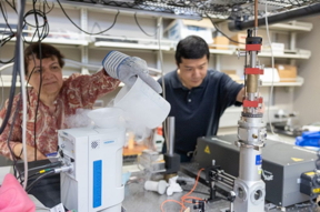 Giti Khodaparast (left) and Wei Zhou in the Nonlinear Spectroscopy Lab at ICTAS II on Virginia Tech's Blacksburg campus.  Photo by Chelsea Seeber for Virginia Tech.